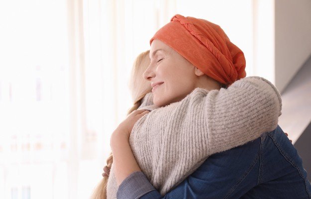cancer patient hugging her family | 5 Proven Health Benefits Of Liquid Chlorophyll