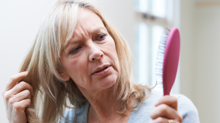 mature-woman-brush-corncerned-about-hair-ss-Does Diabetes Cause Hair Loss_-Feature | Does Diabetes Cause Hair Loss?