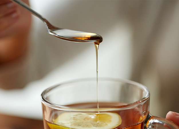 PH-adding honey to tea cup with lemon-ss-What Is Fructose_